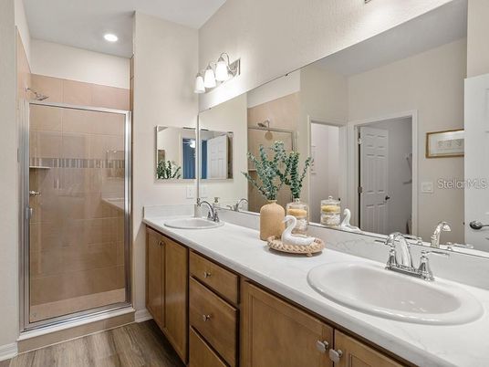Bathroom, Dual Sink Vanities, Glass Shower, Interior, Recessed Lighting, Wood Texture Flooring