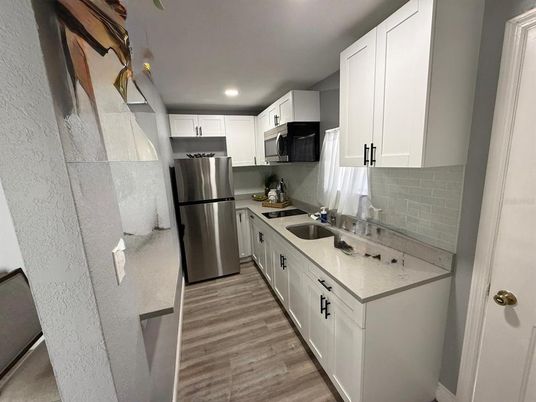 Interior, Kitchen, Recessed Lighting, Stainless Steel Appliances, Wood Texture Flooring