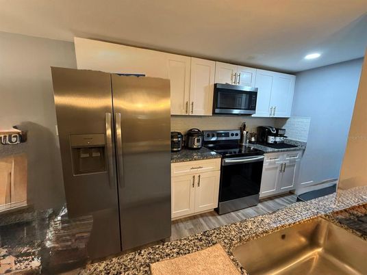 Interior, Kitchen, Recessed Lighting, Stainless Steel Appliances, Wood Texture Flooring