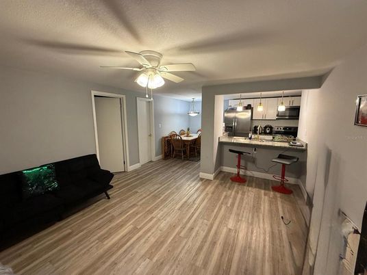 Dining room, Interior, Kitchen, Pendant Lights, Stainless Steel Appliances, Wood Texture Flooring