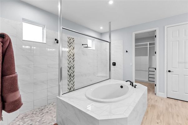 Bathroom, Glass Shower, Interior, Marble Walls, Recessed Lighting, Wood Texture Flooring