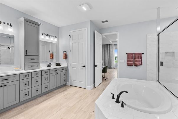 Bathroom, Dual Sink Vanities, Glass Shower, Interior, Recessed Lighting, Wood Texture Flooring