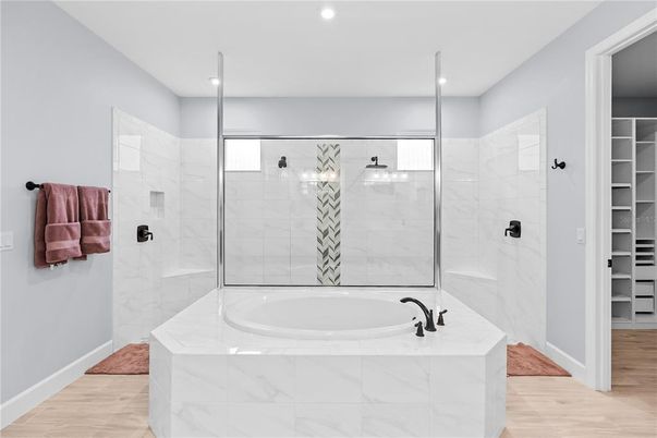 Bathroom, Glass Shower, Interior, Marble Walls, Recessed Lighting, Wood Texture Flooring