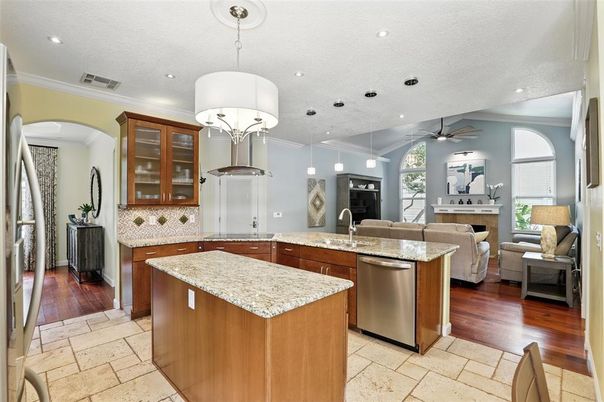 Chandelier, Interior, Kitchen, Living room, Pendant Lights, Recessed Lighting, Stainless Steel Appliances, Wood Texture Flooring