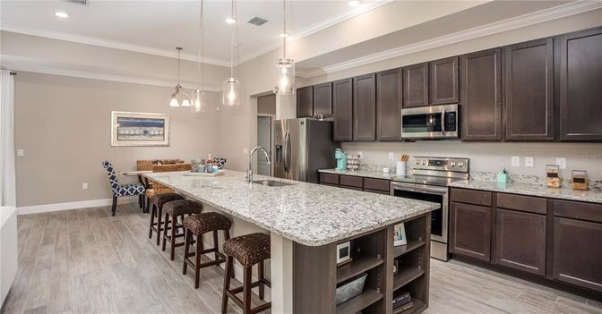 Dining room, Interior, Kitchen, Pendant Lights, Recessed Lighting, Stainless Steel Appliances, Wood Texture Flooring