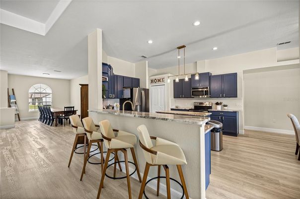 Dining room, Interior, Kitchen, Pendant Lights, Recessed Lighting, Stainless Steel Appliances, Wood Texture Flooring