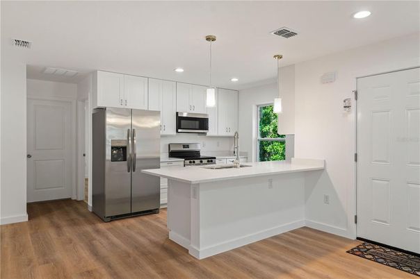 Interior, Kitchen, Pendant Lights, Recessed Lighting, Stainless Steel Appliances, Wood Texture Flooring