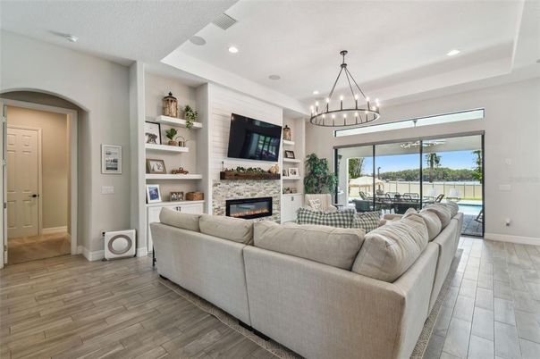 Chandelier, Fireplace, Interior, Living room, Pendant Lights, Recessed Lighting, Wood Texture Flooring