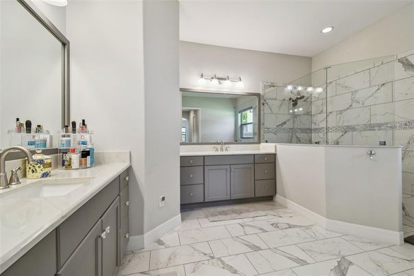 Bathroom, Dual Sink Vanities, Glass Shower, Interior, Marble, Marble Walls, Recessed Lighting
