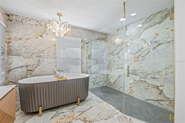 Bathroom, Chandelier, Free Standing Baths, Glass Shower, Interior, Marble, Marble Walls, Recessed Lighting