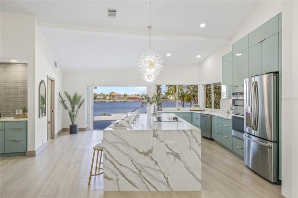 Chandelier, Interior, Kitchen, Pendant Lights, Recessed Lighting, Stainless Steel Appliances, Water, Wood Texture Flooring
