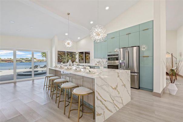 Chandelier, Interior, Kitchen, Pendant Lights, Recessed Lighting, Stainless Steel Appliances, Water, Wood Texture Flooring