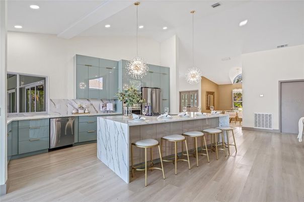 Chandelier, Interior, Kitchen, Pendant Lights, Recessed Lighting, Stainless Steel Appliances, Wood Texture Flooring