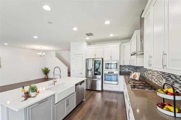 Chandelier, Interior, Kitchen, Recessed Lighting, Stainless Steel Appliances, Wood Texture Flooring