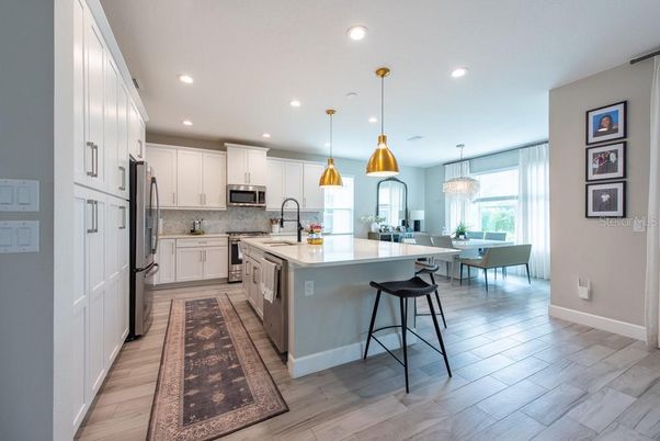 Dining room, Interior, Kitchen, Pendant Lights, Recessed Lighting, Stainless Steel Appliances, Wood Texture Flooring