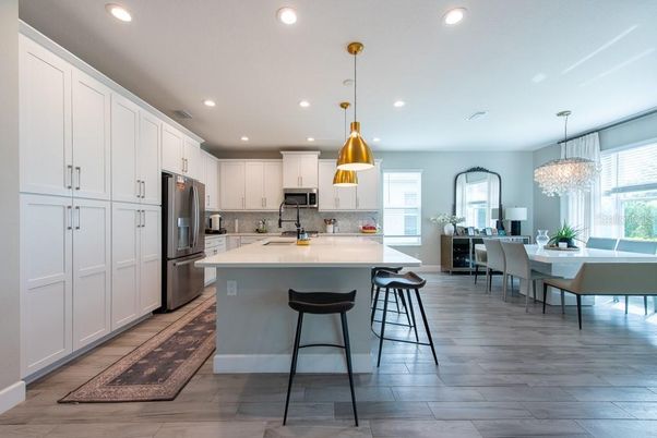 Chandelier, Dining room, Interior, Kitchen, Pendant Lights, Recessed Lighting, Stainless Steel Appliances, Wood Texture Flooring