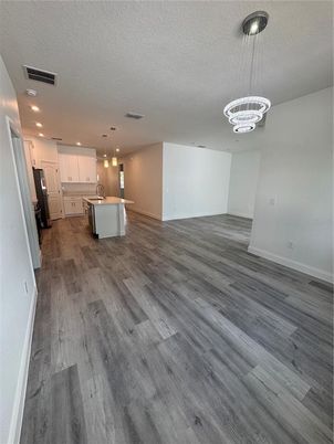 Chandelier, Empty room, Interior, Kitchen, Pendant Lights, Recessed Lighting, Wood Texture Flooring