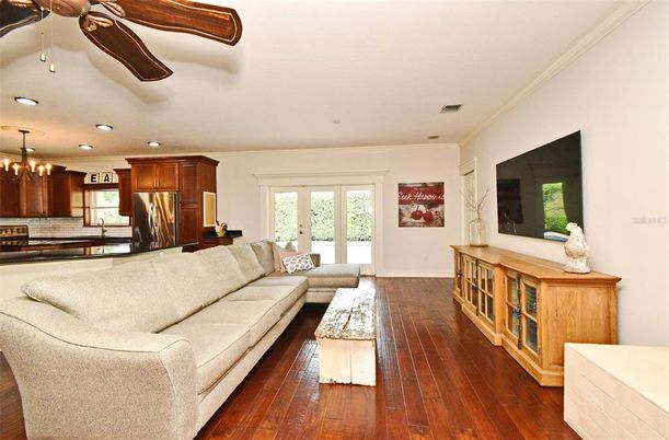Chandelier, Interior, Kitchen, Living room, Recessed Lighting, Stainless Steel Appliances, Wood Texture Flooring
