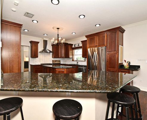 Chandelier, Interior, Kitchen, Pendant Lights, Recessed Lighting, Stainless Steel Appliances, Wood Texture Flooring