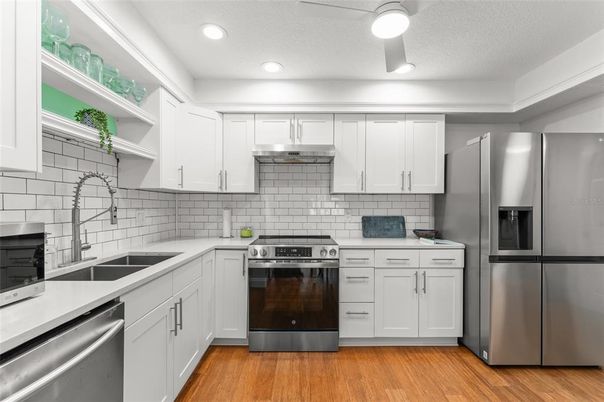 Interior, Kitchen, Recessed Lighting, Stainless Steel Appliances, Wood Texture Flooring