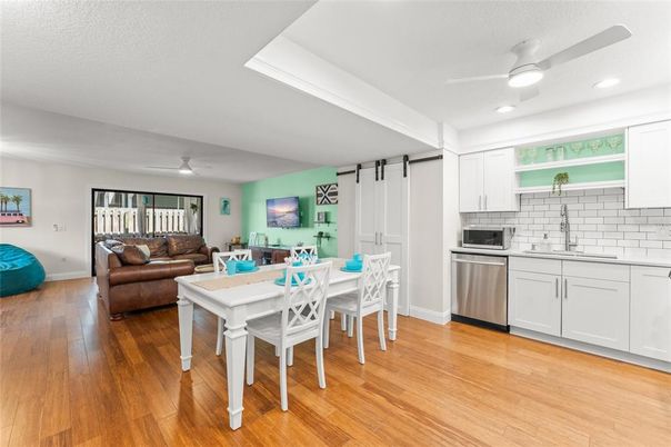 Dining room, Interior, Kitchen, Living room, Recessed Lighting, Stainless Steel Appliances, Wood Texture Flooring