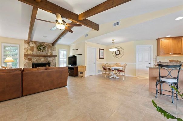 Dining room, Fireplace, Interior, Living room, Pendant Lights, Recessed Lighting, Stone Walls, Wooden Beams