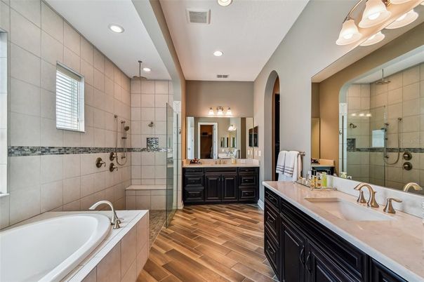 Bathroom, Dual Sink Vanities, Glass Shower, Interior, Recessed Lighting, Wood Texture Flooring