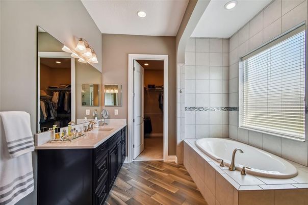 Bathroom, Dual Sink Vanities, Interior, Recessed Lighting, Walk-in Closets, Wood Texture Flooring
