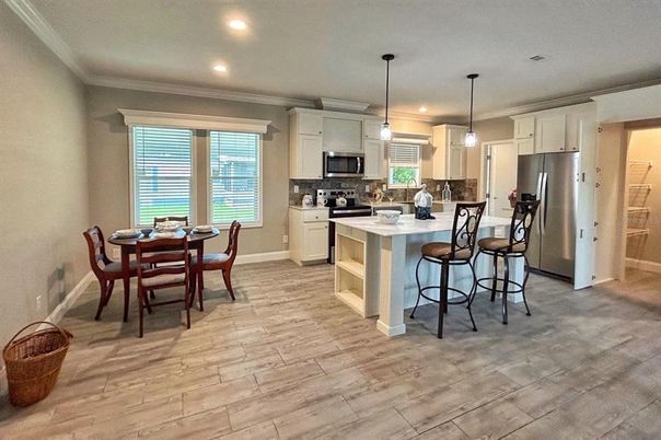 Dining room, Interior, Kitchen, Pendant Lights, Recessed Lighting, Stainless Steel Appliances, Wood Texture Flooring