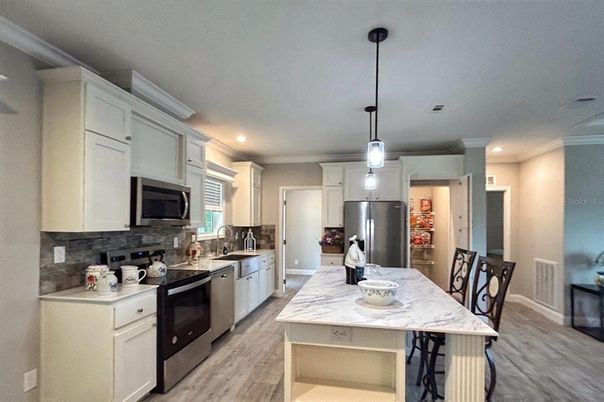 Interior, Kitchen, Pendant Lights, Recessed Lighting, Stainless Steel Appliances, Wood Texture Flooring