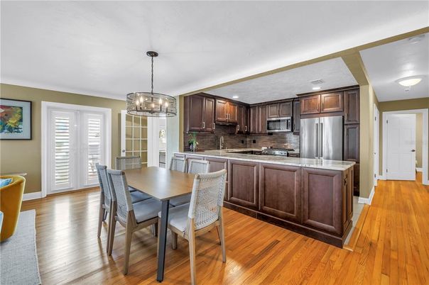 Dining room, Interior, Kitchen, Pendant Lights, Recessed Lighting, Stainless Steel Appliances, Wood Texture Flooring