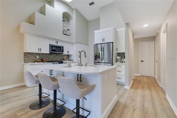 Interior, Kitchen, Recessed Lighting, Stainless Steel Appliances, Wood Texture Flooring