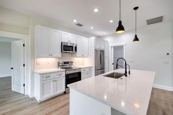 Interior, Kitchen, Pendant Lights, Recessed Lighting, Stainless Steel Appliances, Wood Texture Flooring