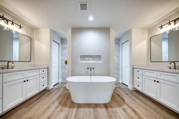 Bathroom, Dual Sink Vanities, Free Standing Baths, Interior, Recessed Lighting, Wood Texture Flooring