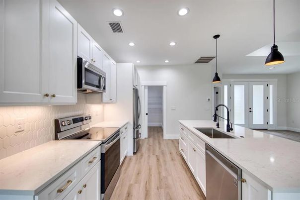 Interior, Kitchen, Pendant Lights, Recessed Lighting, Stainless Steel Appliances, Wood Texture Flooring