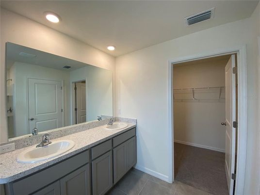 Bathroom, Dual Sink Vanities, Interior, Recessed Lighting, Walk-in Closets