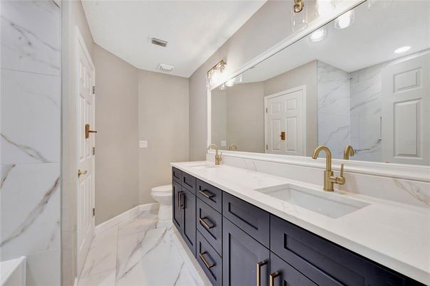 Bathroom, Dual Sink Vanities, Interior, Marble, Marble Walls, Recessed Lighting