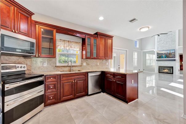 Fireplace, Interior, Kitchen, Recessed Lighting, Stainless Steel Appliances
