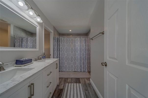 Bathroom, Dual Sink Vanities, Interior, Recessed Lighting, Wood Texture Flooring