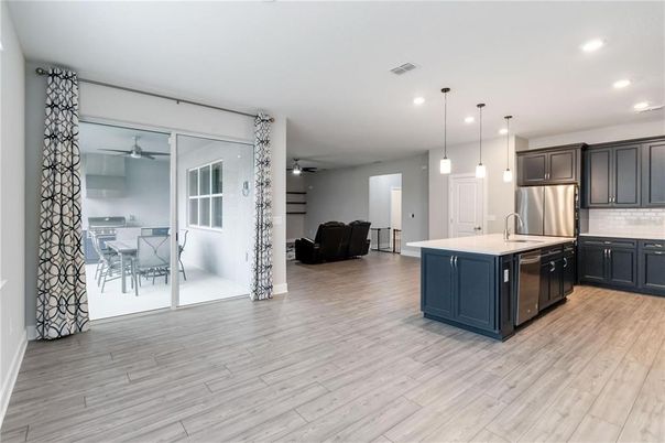 Dining room, Interior, Kitchen, Pendant Lights, Recessed Lighting, Stainless Steel Appliances, Wood Texture Flooring