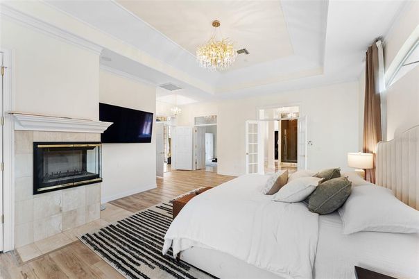 Bedroom, Chandelier, Fireplace, Interior, Pendant Lights, Wood Texture Flooring