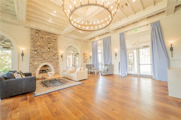 Chandelier, Fireplace, Interior, Living room, Stone Walls, Wooden Ceilings, Wood Texture Flooring