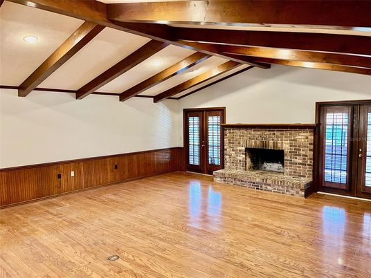 Empty room, Fireplace, Interior, Recessed Lighting, Stone Walls, Wooden Beams, Wood Texture Flooring