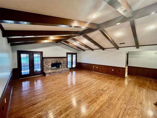 Empty room, Fireplace, Interior, Recessed Lighting, Stone Walls, Wooden Beams, Wood Texture Flooring