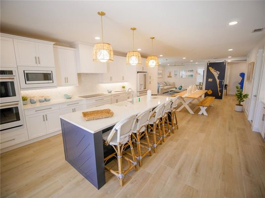 Dining room, Interior, Kitchen, Pendant Lights, Recessed Lighting, Stainless Steel Appliances, Wood Texture Flooring