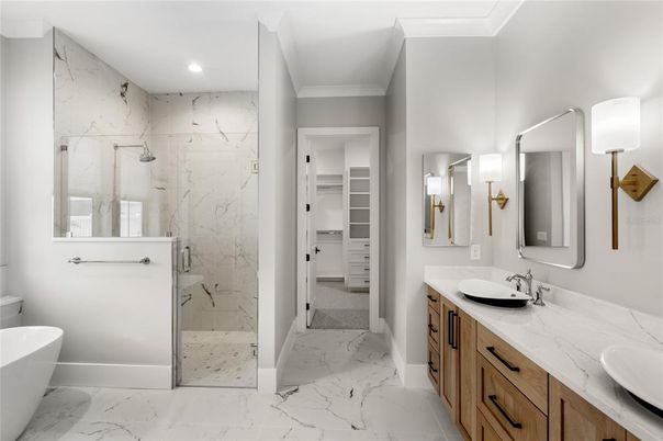 Bathroom, Dual Sink Vanities, Free Standing Baths, Glass Shower, Interior, Marble, Marble Walls, Recessed Lighting, Walk-in Closets