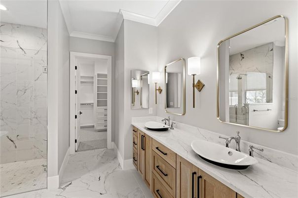 Bathroom, Dual Sink Vanities, Glass Shower, Interior, Marble, Marble Walls, Recessed Lighting, Walk-in Closets