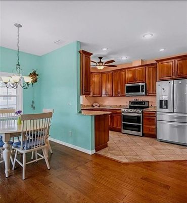 Chandelier, Interior, Kitchen, Recessed Lighting, Stainless Steel Appliances, Wood Texture Flooring