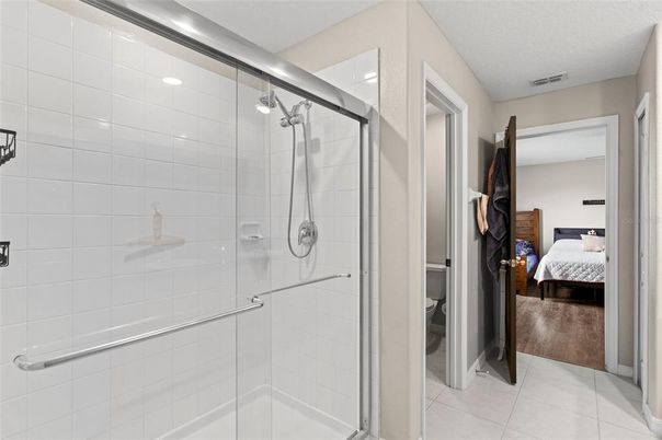 Bathroom, Bedroom, Glass Shower, Interior, Recessed Lighting, Wood Texture Flooring