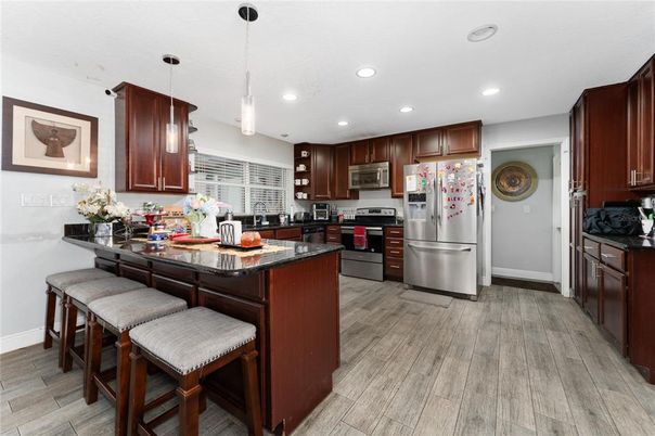 Interior, Kitchen, Pendant Lights, Recessed Lighting, Stainless Steel Appliances, Wood Texture Flooring